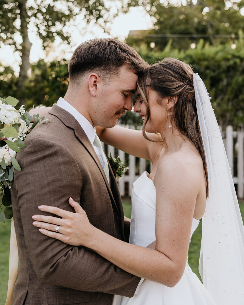 bride and groom touch foreheads