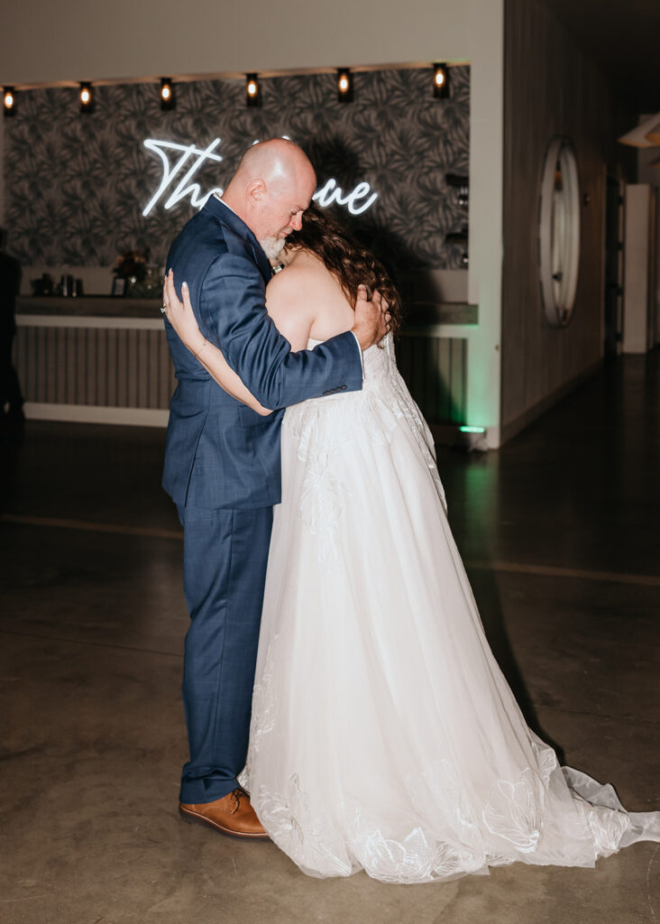 bride and dad share their first dance