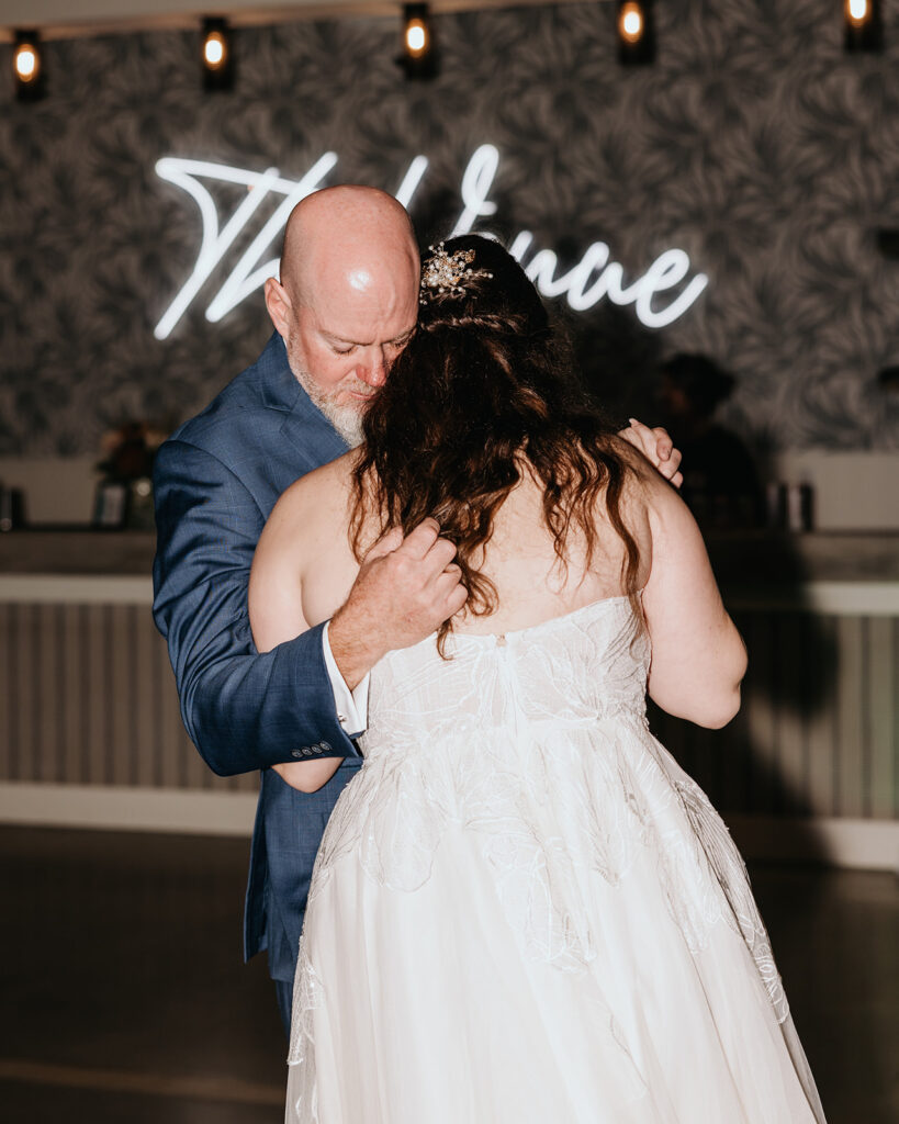 bride and dad share their first dance