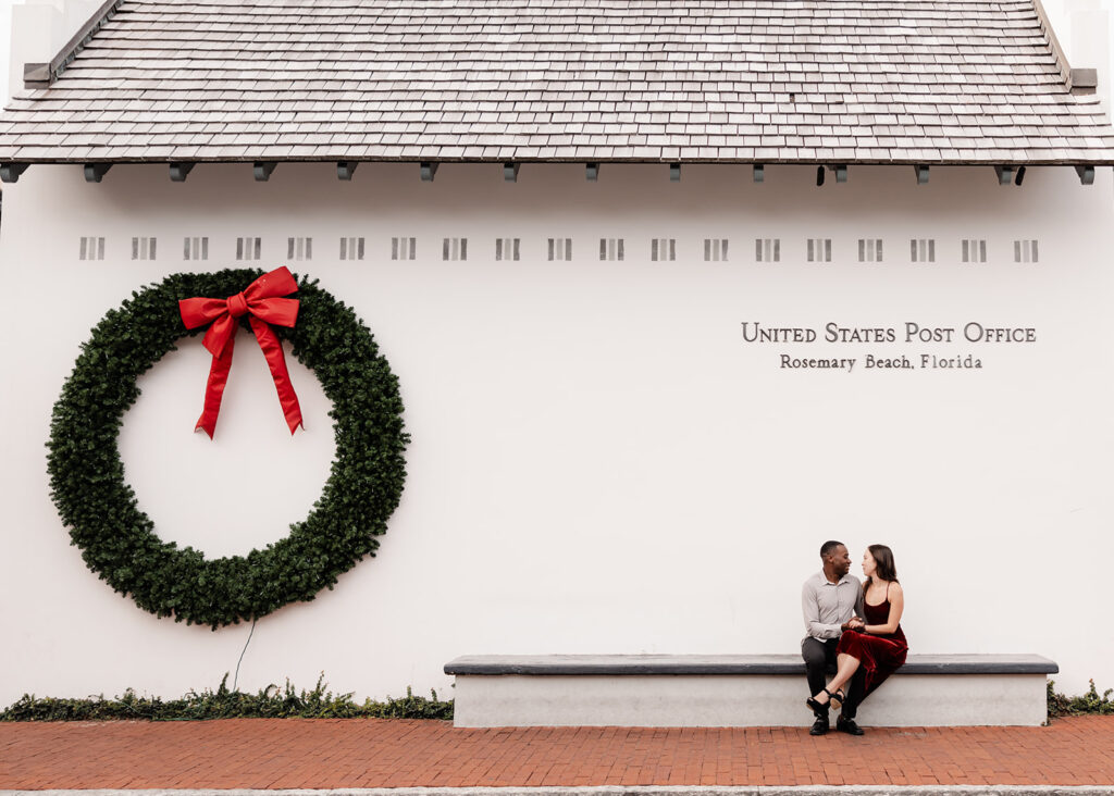 man and woman sit outside the Rosemary Beach post office