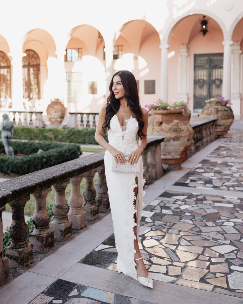 bride poses in front of the Ringling Art Museum