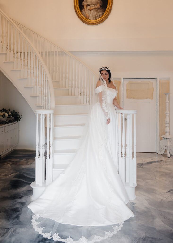 bride stands on a staircase