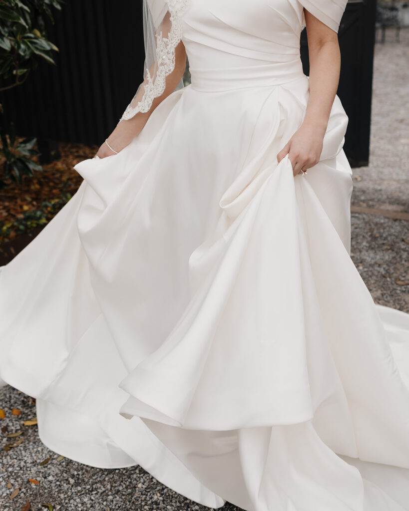 bride sways in her wedding gown