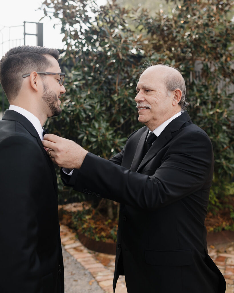 father helps the groom get ready
