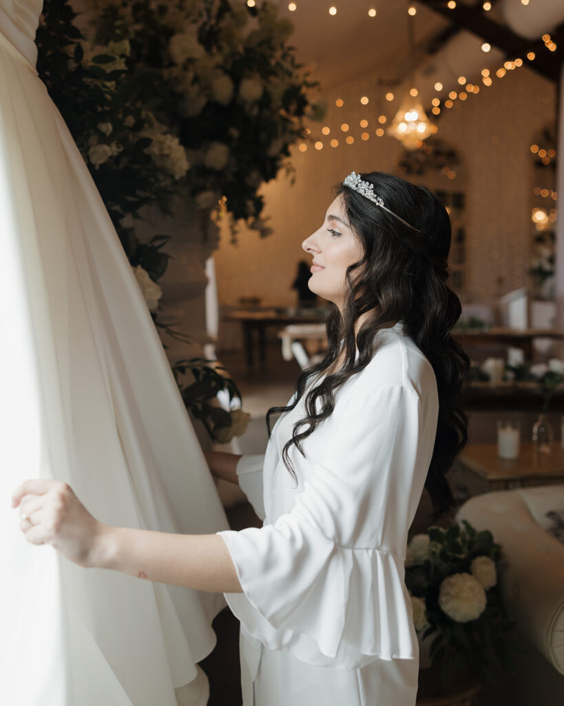 bride looks at her wedding dress