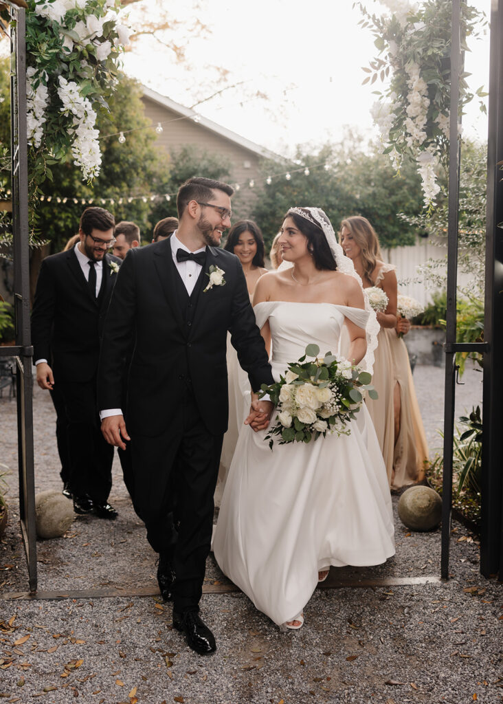 bride and groom walk