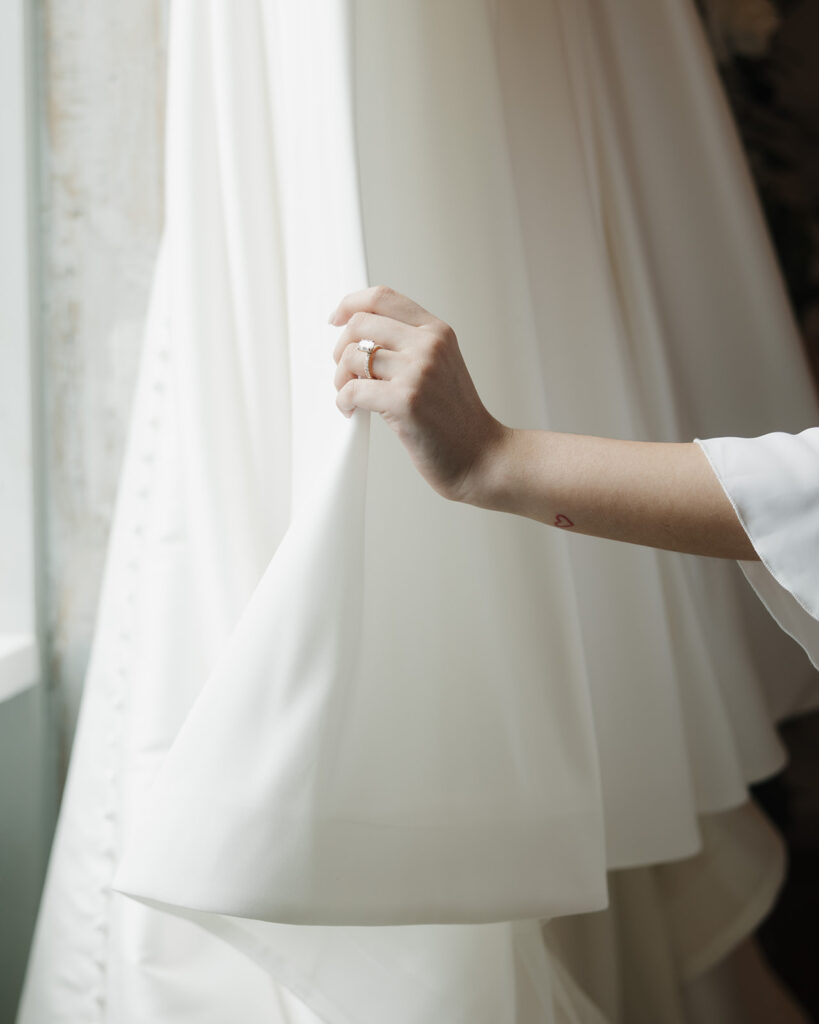 bride looks at her wedding dress
