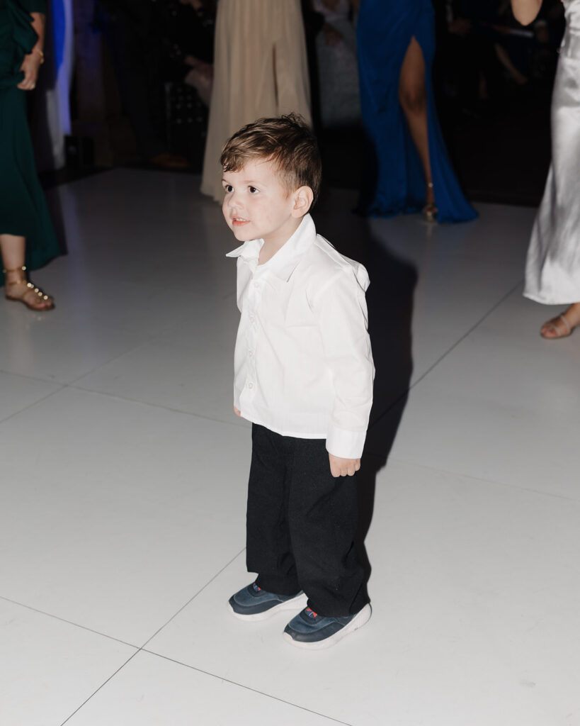little boy dances at wedding