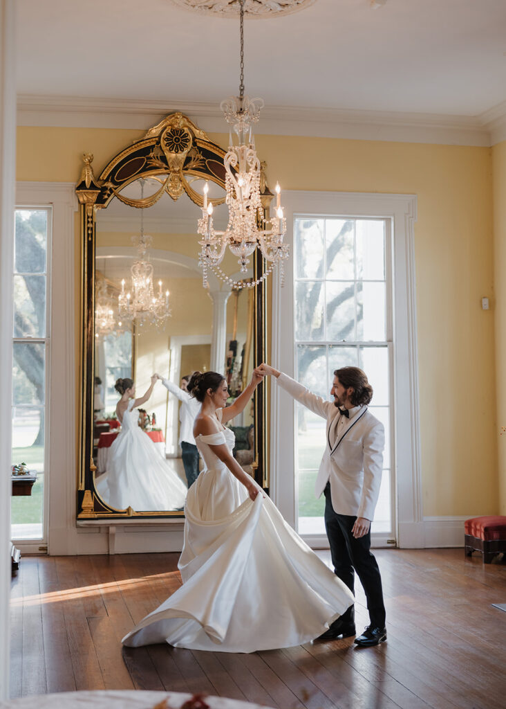 bride and groom dance in a ballroom