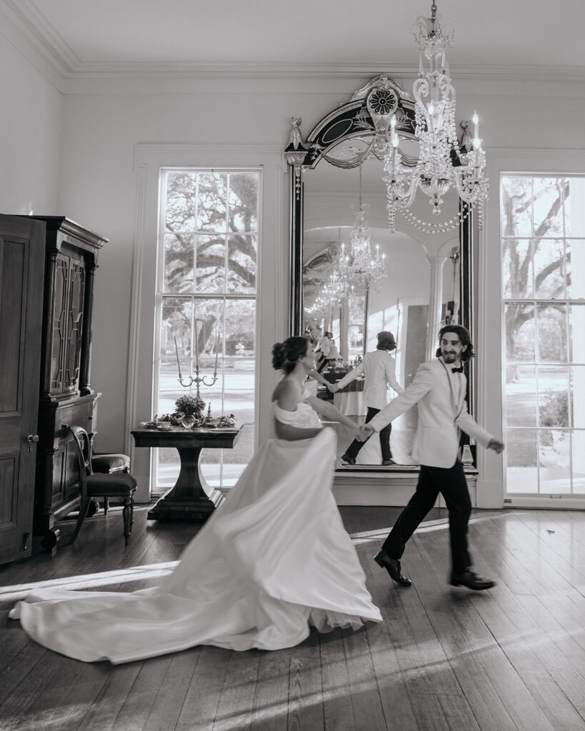 bride and groom run through a room