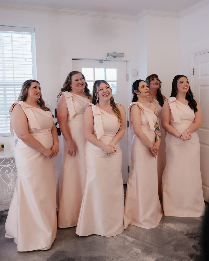 bridesmaids react to seeing the bride