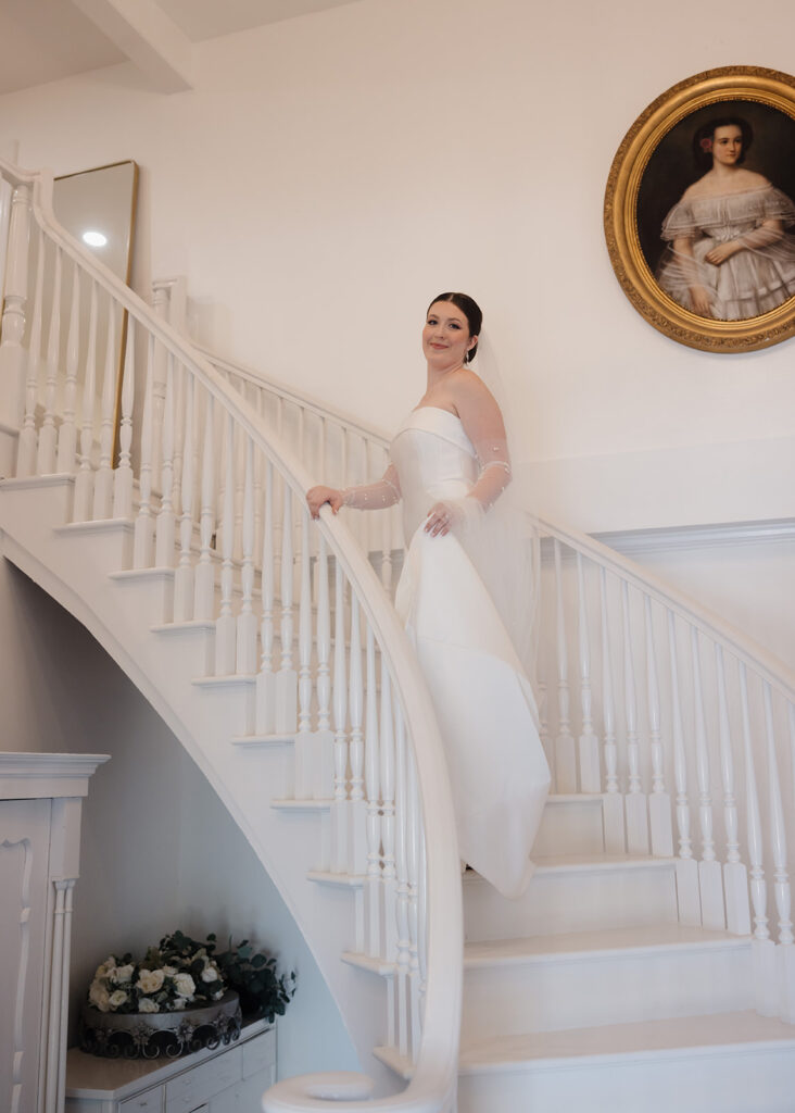 bride walks up a staircase