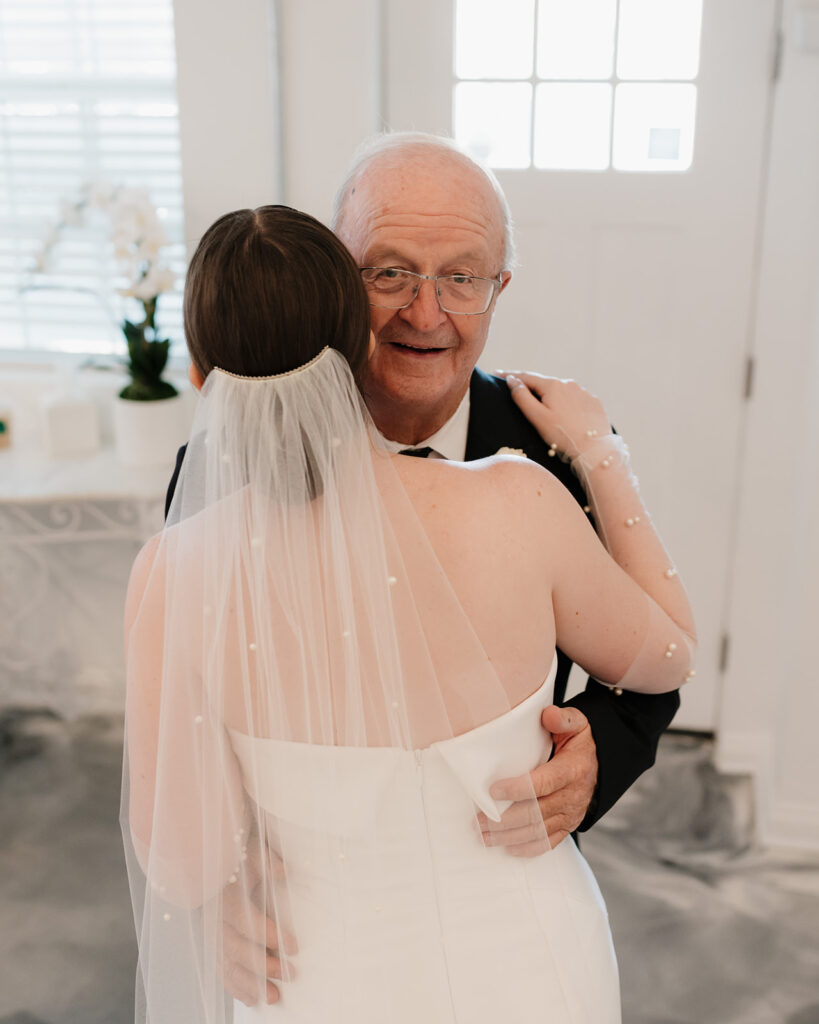 bride hugs grandpa