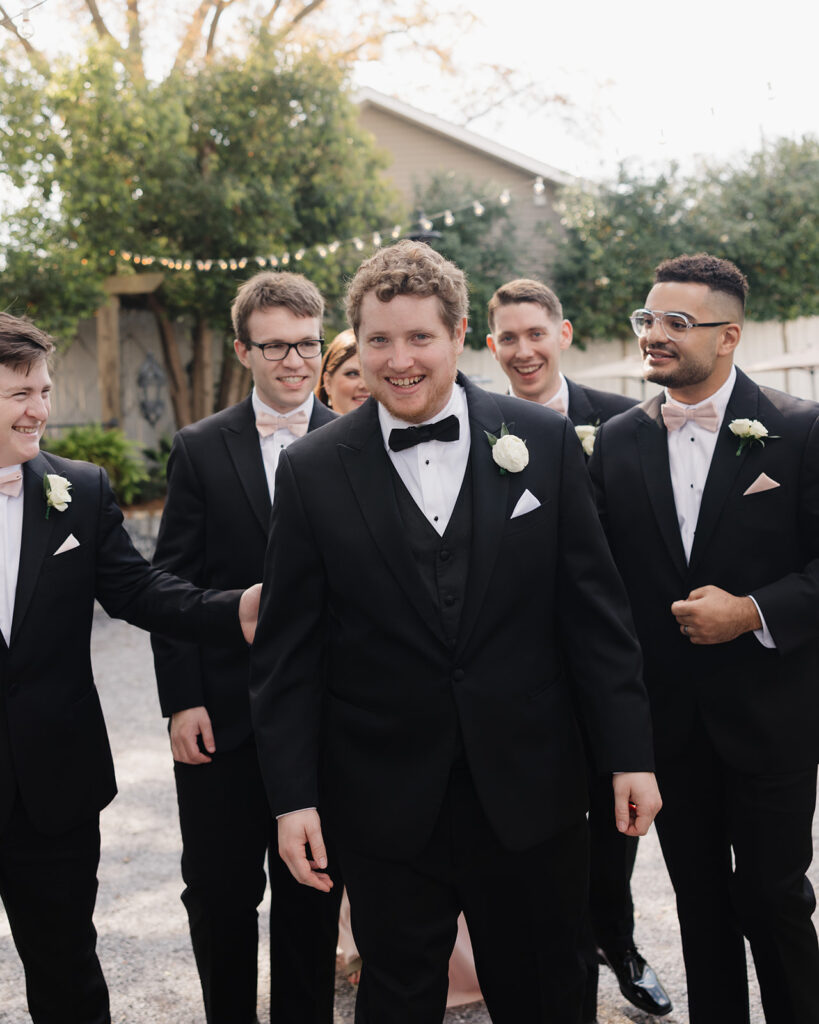 groom and groomsmen walk