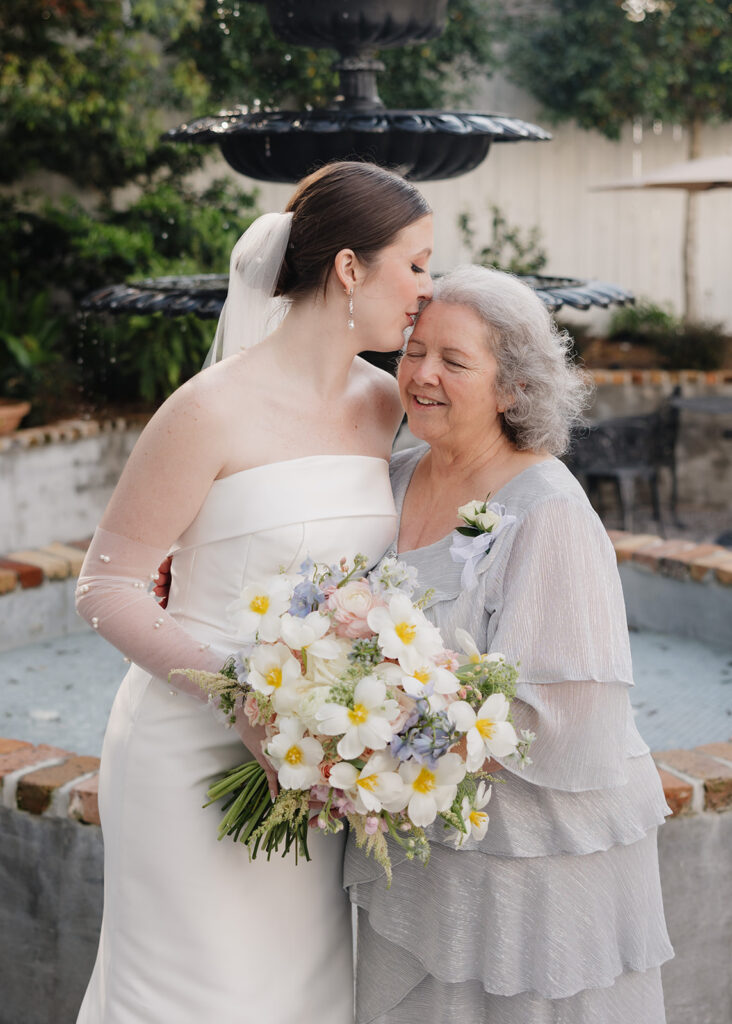 bride kisses her grandmother
