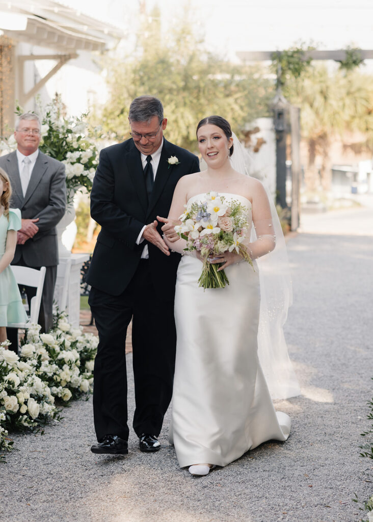 bride and father walk down the aisle