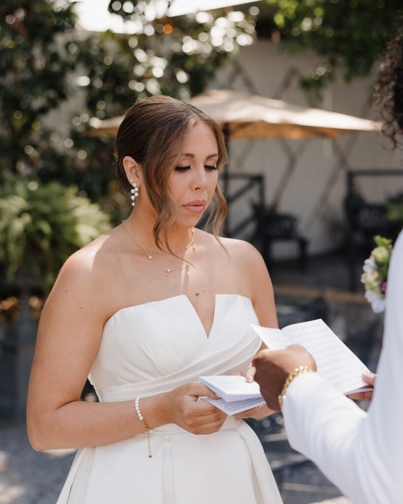 woman cries while reading vows