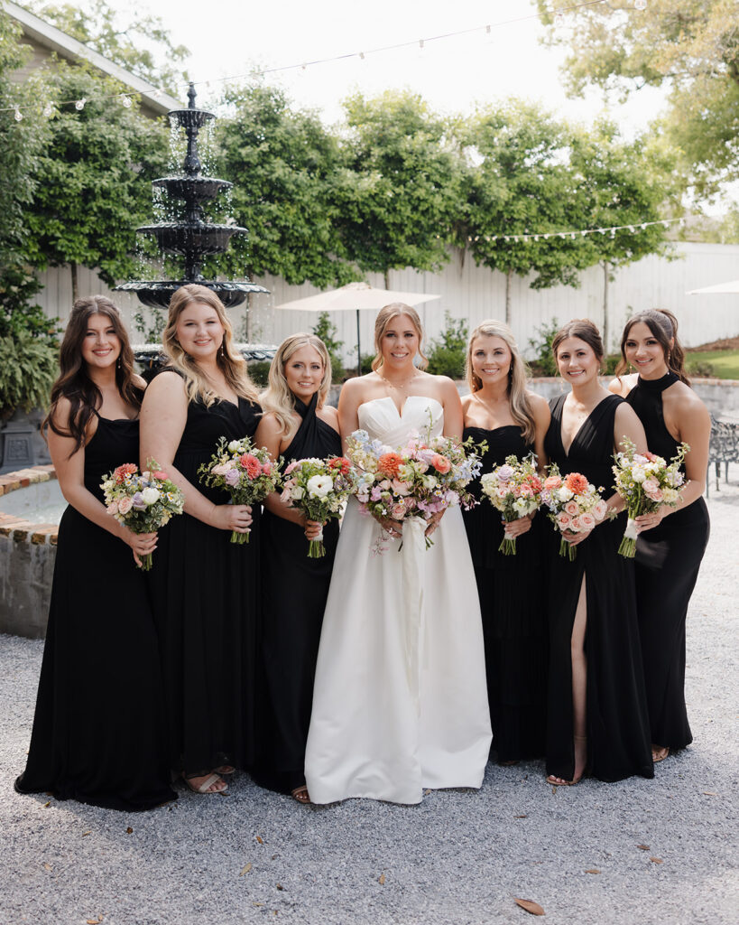 bride and bridal party smile