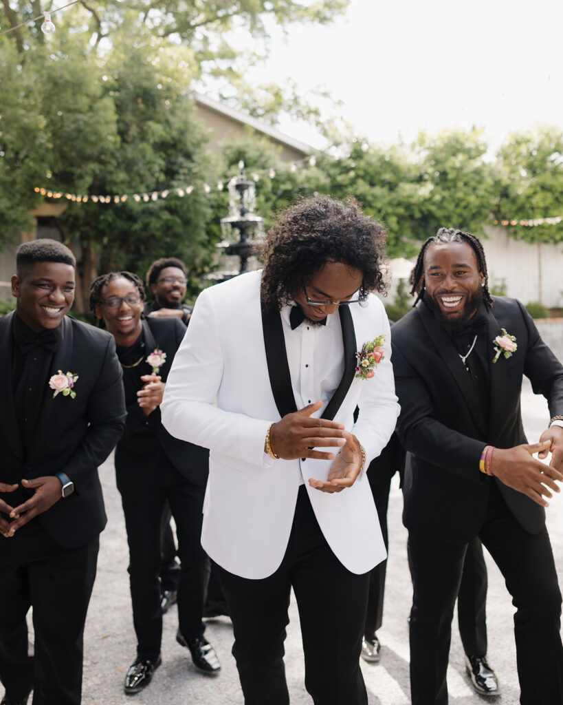 groom and groomsmen laugh