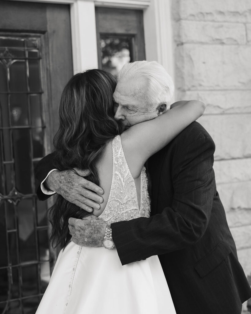 bride hugs her grandfather