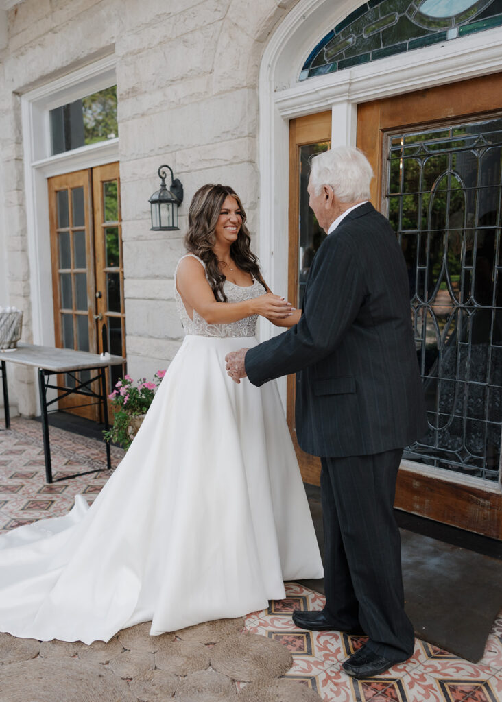 bride smiles at her grandfather