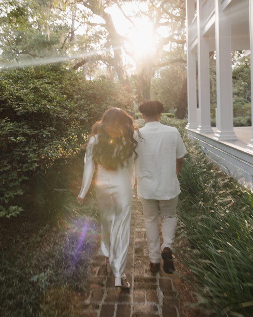 man and woman run through the trees