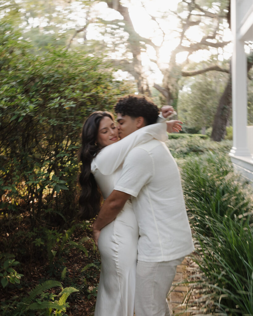 man kisses woman's cheek