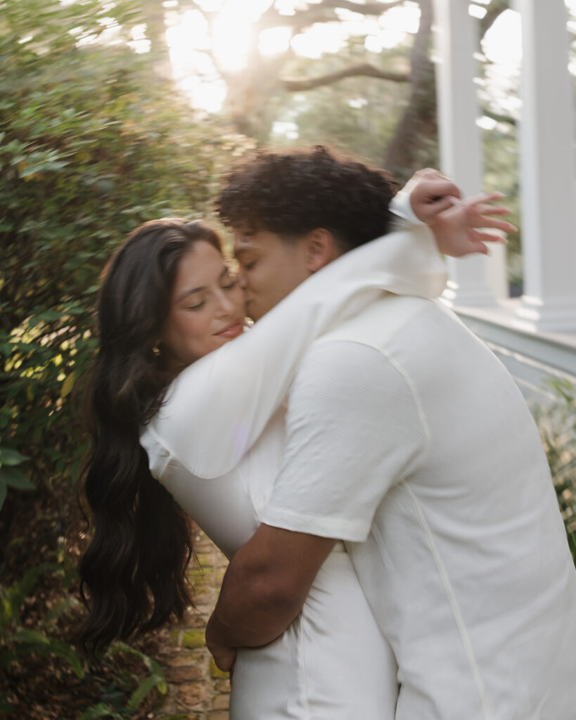 man kisses woman's cheek