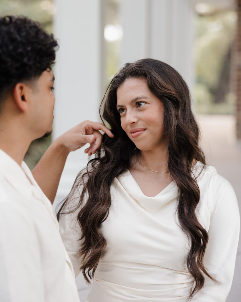 woman stares into man's eyes