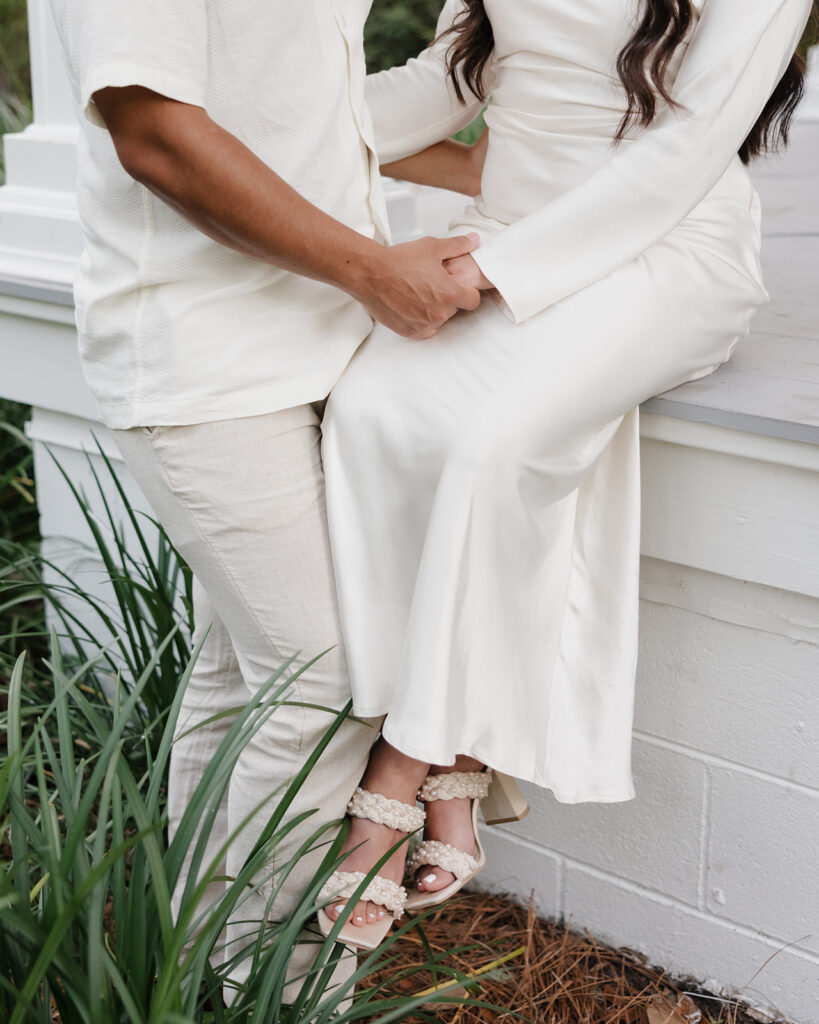 man holds woman's hand