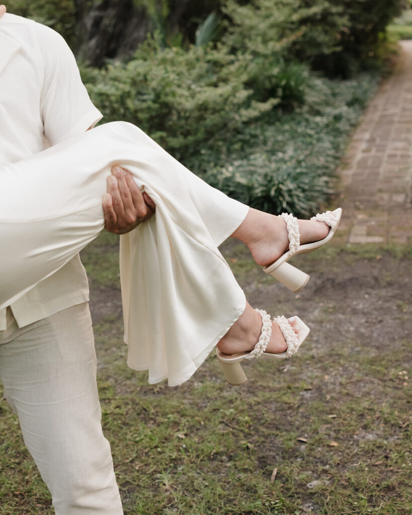 man holds woman and spins