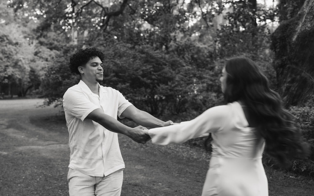 man and woman spin around in circles