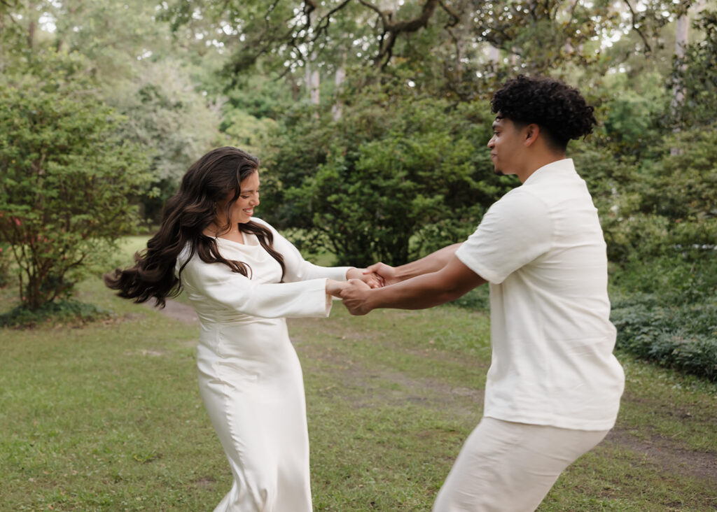 woman and man spin around in circles