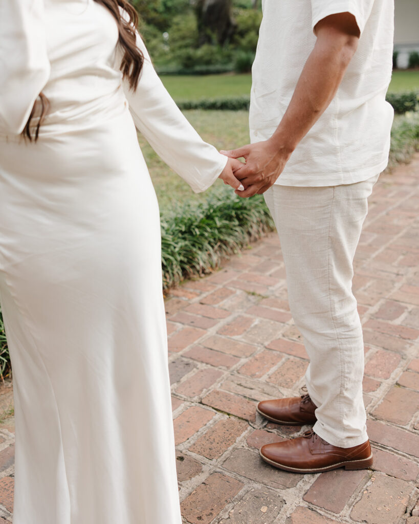 man and woman hold hands