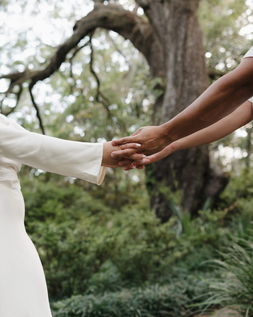 woman and man hold hands