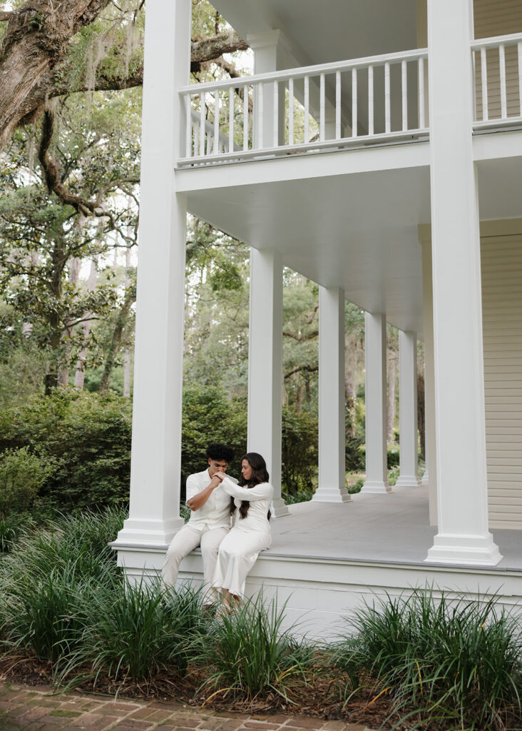 man and woman sit on the porch at Eden Gardens State Park