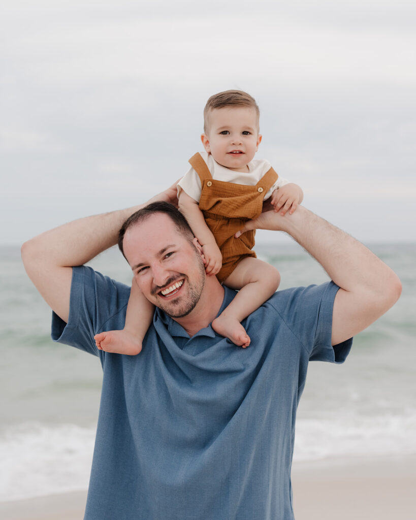 father and baby smile