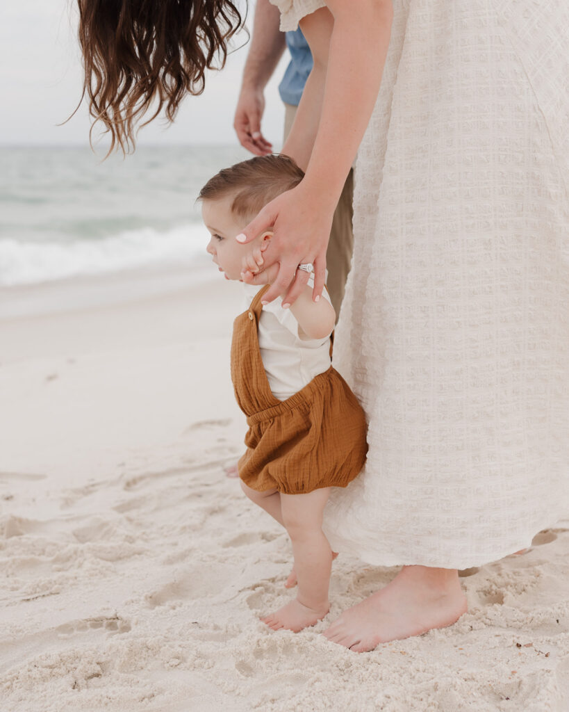 mother walks with baby on Pensacola Beach