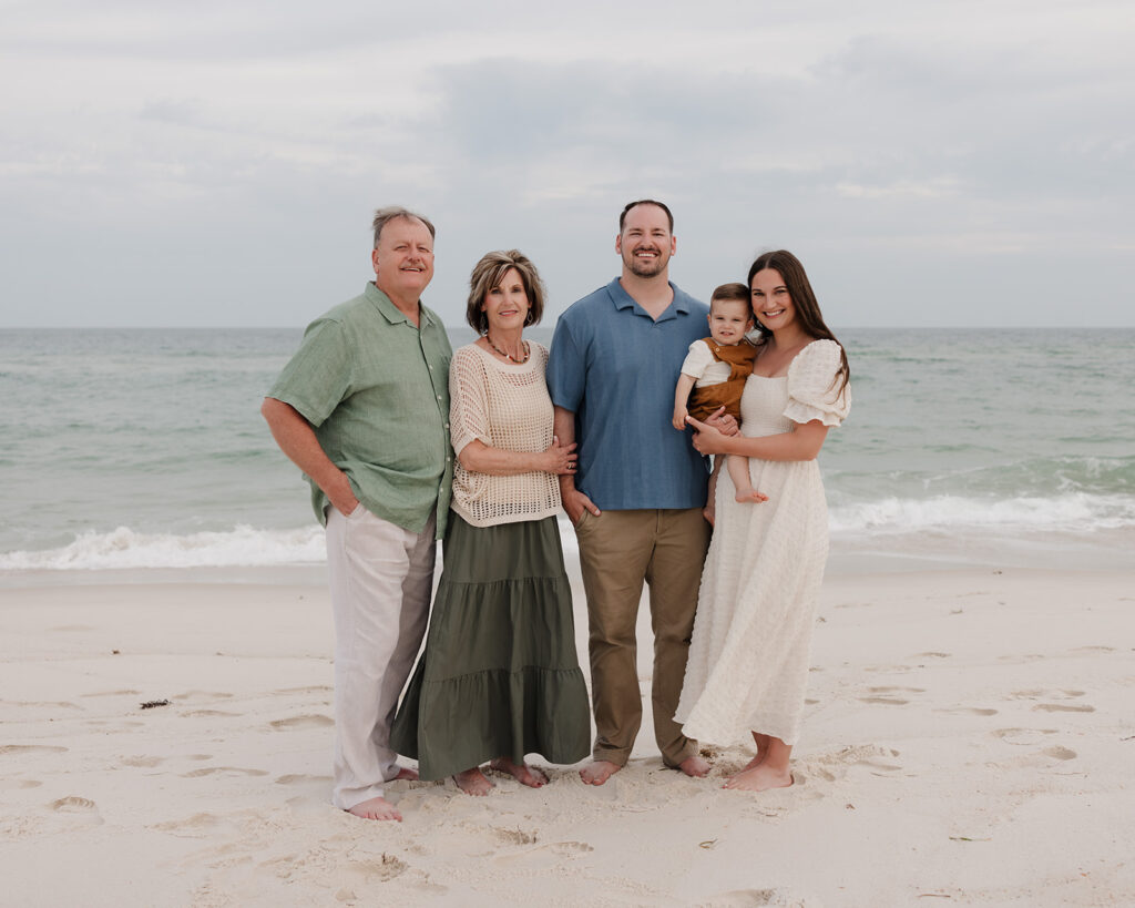 a family smiles on Pensacola Beach