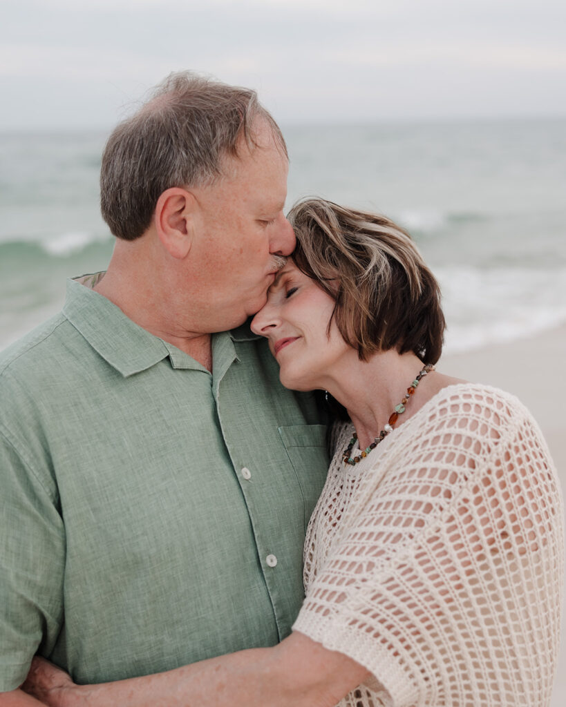 woman rests her head on her husband's shoulder