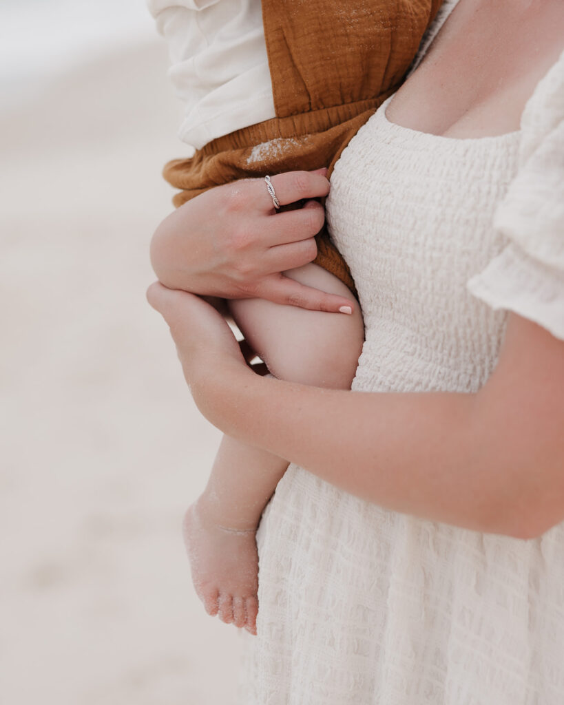 mom holds baby close