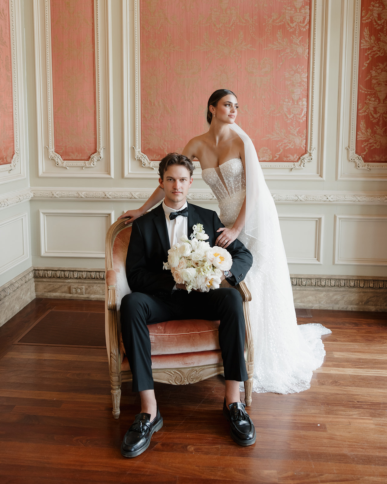 bride and groom pose in the Olana's bridal suite