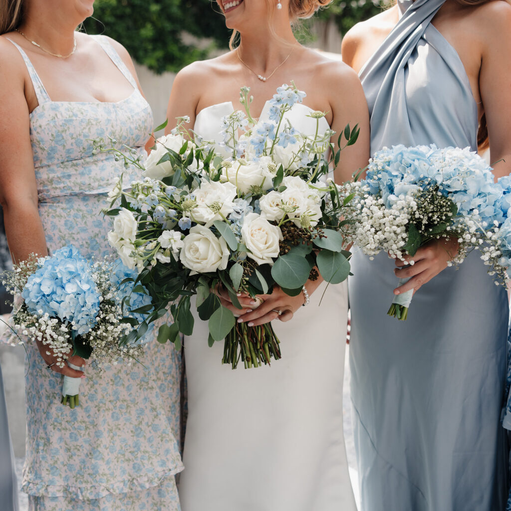 bride and bridesmaids hold bouquets