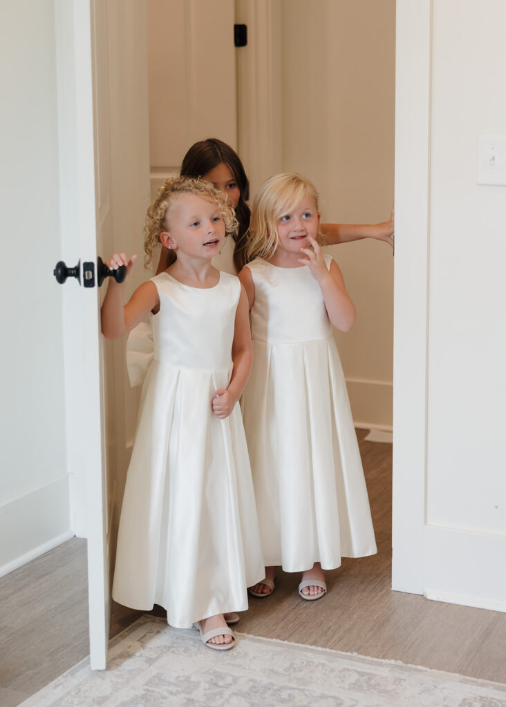 flower girls see the bride