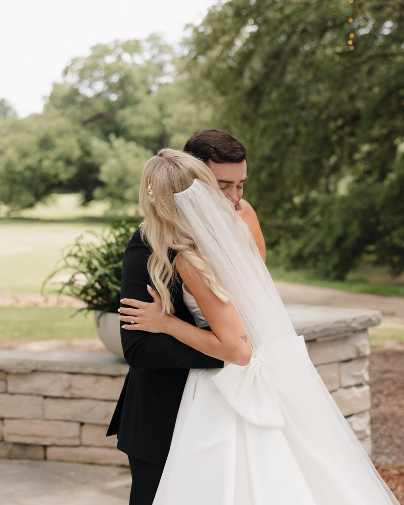 bride and groom hug