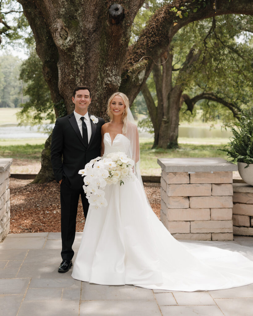 bride and groom smile at the Reed House in Jackson, MS