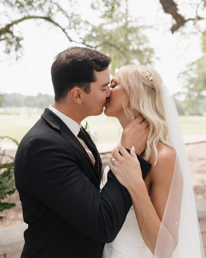 bride and groom kiss