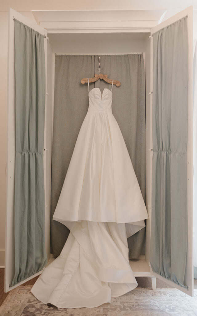 bride's wedding gown hangs up at the Reed House in Jackson, MS