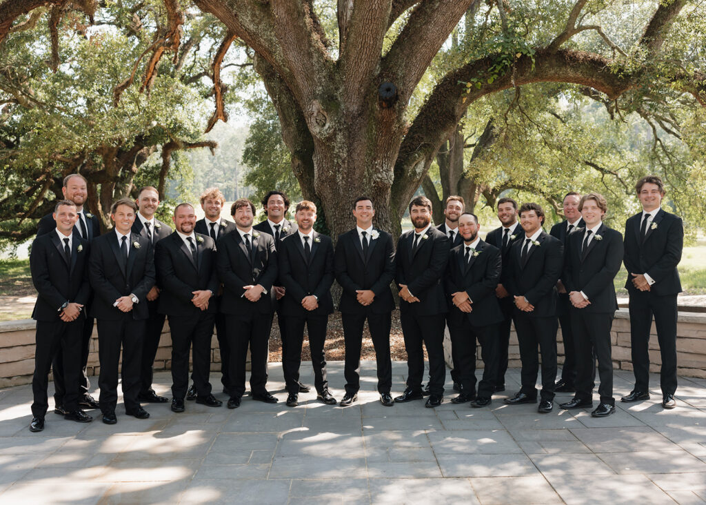 groom and groomsmen smile