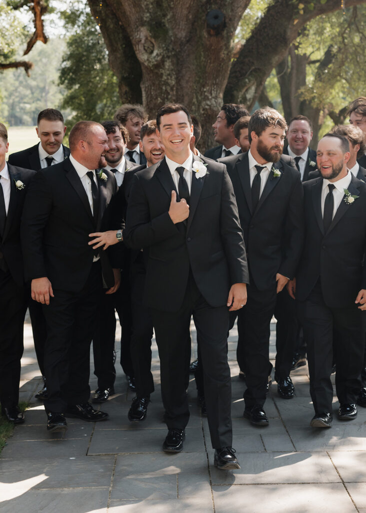 groom and groomsmen walk